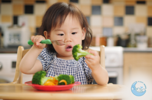 Baby Playing with Veggies