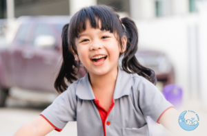 Toddler smiling while cycling